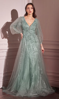 A woman wears the Ladivine CD0102 Sheer-Sleeve Long Prom Dress in light green, featuring a V-neck, sheer long sleeves, and floral sequin embellishments, standing before a white paneled wall.