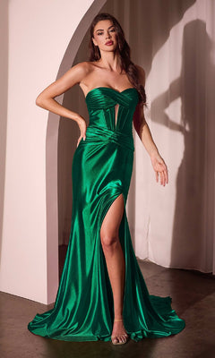 A woman stands indoors by a white curtain, wearing the Ladivine CD0103, a strapless long satin prom dress in emerald green featuring a thigh-high slit.