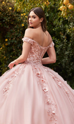 A woman stands outdoors among greenery and yellow flowers, looking back over her shoulder in the Off-Shoulder Long Sweetheart Prom Ball Gown CD0185.
