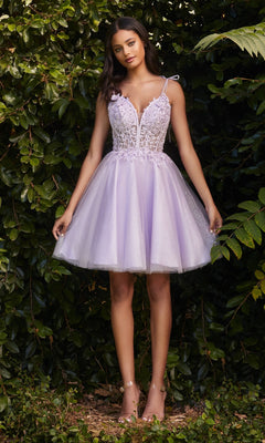 A woman poses outdoors before greenery, wearing the Glitter-Tulle Short A-Line Prom Dress CD0188 featuring a fitted, lace-embellished bodice, shoulder straps, and open-toe heels.