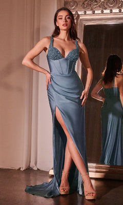 A woman stands on a hardwood floor in front of a mirror, wearing the Ladivine CD0231 Long Sweetheart Prom Dress—a sleeveless, light blue gown with a corset bodice and thigh-high slit.