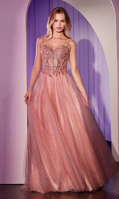A woman stands in an archway wearing the Ladivine CD0234 Glitter-Tulle Long Prom Dress, a sleeveless blush pink gown with an embellished sweetheart bodice and a flowing tulle skirt.