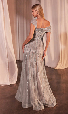 A woman stands in a softly lit room wearing the Ladivine CD0238, a cap-sleeve long beaded prom dress with shimmering details and a sheer overlay.