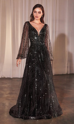 A woman stands indoors in the Ladivine CD0240, a floor-length black formal dress with sheer long sleeves and sparkling sequin beading, set against white curtains.