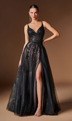A woman stands against a plain brown background wearing the Ladivine CD2412 long prom dress in Black/Nude, featuring a sleeveless design, deep neckline, beaded embellishments, glitter tulle a-line skirt with sheer overlay and high slit.
