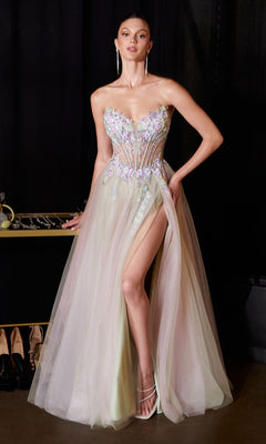 A woman wearing the Ladivine CD2418 long prom dress in sage—a strapless gown with an embroidered corset bodice, sheer tulle A-line skirt, floral adornments, and a high slit—stands with one hand on her hip.