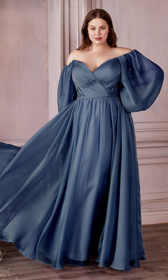 A woman models the Ladivine Plus-Size Off-Shoulder Prom Dress CD243C, featuring sheer, billowy long sleeves and a floor-length blue design that flatters her figure as she poses indoors against a light-colored wall.