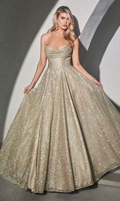 A woman wears the Draped-Bodice Long Glitter A-Line Prom Dress CD252—a shimmering gold gown with thin straps, a corset bodice, and a flared, floor-length skirt.