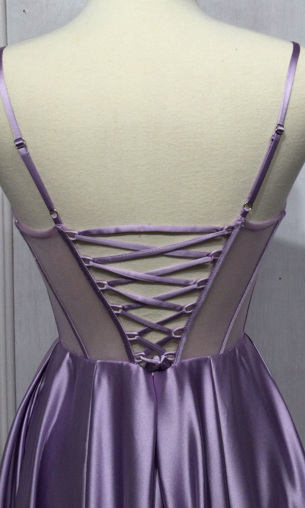 Back view of the Sheer-Corset Long A-Line Prom Dress CD276 in lilac satin, with thin straps and a crisscross lace-up detail over a sheer mesh panel that highlights the corset waist.