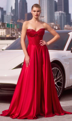 A woman wearing the Ladivine CD297 Strapless Long A-Line Prom Dress stands in front of a white car with a city skyline behind her.