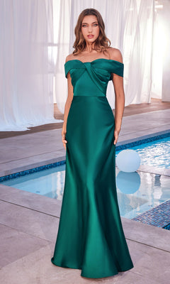 By an indoor pool, a woman wears the Off-the-Shoulder Long Prom Dress with Train CD325 in emerald green satin, showcasing a fitted bodice and flared skirt for an elegant formal appearance.
