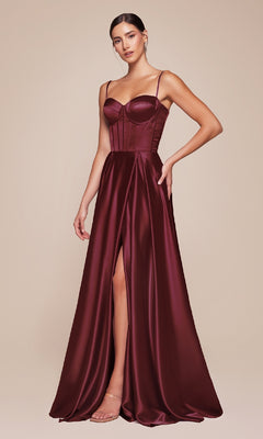 A woman stands against a plain beige background wearing the Ladivine CD337 Long Sweetheart A-Line Prom Dress—a sleeveless, floor-length burgundy gown featuring a corset bodice and thigh-high slit.