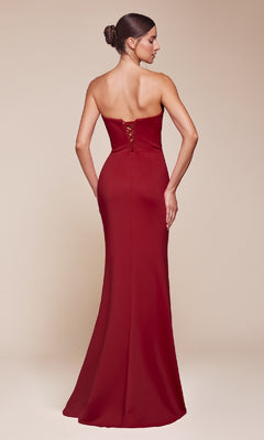 A woman faces away from the camera, showcasing the Ladivine CD355—a strapless, floor-length red prom gown with a fitted silhouette and elegant lace-up back detail.