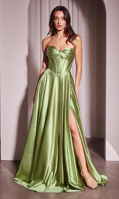 A woman stands in a doorway wearing the Ladivine CD378, a strapless long a-line prom dress with a shiny light green corset-style bodice and high thigh slit, paired with nude heels.