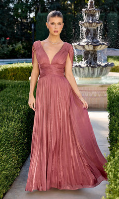 A woman in a Sienna Rose Ladivine CD413 long prom dress stands on a garden path before a tiered fountain, surrounded by lush greenery.
