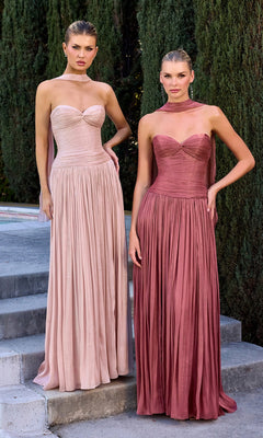 Two women stand on stone steps outdoors, each wearing the Ladivine CD414 Long Prom Dress with a strapless chiffon bodice and pleated a-line skirt—one in blush pink, the other in dusty rose. Tall greenery is visible behind them.