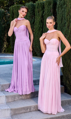 Two women stand outdoors near a pool, wearing the Ladivine CD414 long prom dress in light purple and pink with matching sheer scarves. Tall green hedges are in the background.