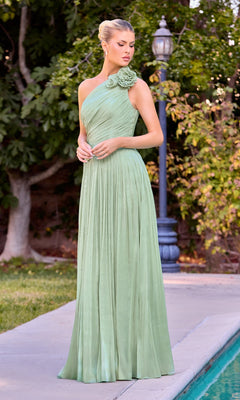 A woman stands outdoors by a pool in the Ladivine CD415 long prom dress in Summer Sage, featuring a one-shoulder design with floral shoulder detail and an elegant, floor-length fit, with trees and a lamp post in the background.