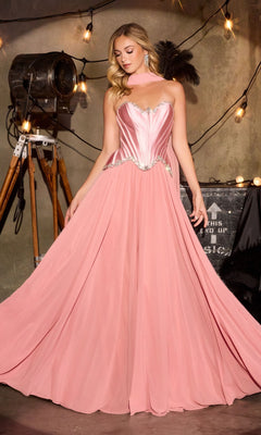 A woman wearing the Ladivine CD668 long prom dress in Dusty Rose, featuring a strapless satin corset bodice and a flowing chiffon A-line skirt, stands indoors against a backdrop of string lights and vintage props.