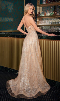 Woman in a sparkly gold evening gown standing in a bar setting
