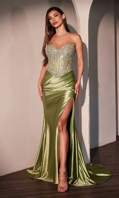 A woman poses indoors against an arched wall wearing the Strapless Long Corset Prom Dress: Ladivine CD736, featuring a beaded corset bodice and a high thigh slit.