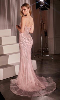 A woman poses near white steps in a studio, wearing the fitted Ladivine CD759 Long Beaded Mermaid Prom Dress with intricate beadwork.