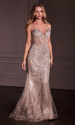 A woman stands in a dimly lit room wearing the Ladivine CD763 Overskirt Long Glitter Prom Dress, a fitted floor-length gown with sparkling geometric beadwork.