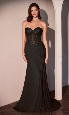 A woman poses in the Ladivine CD770 Strapless Sweetheart Prom Gown, featuring a fitted bodice and draped detailing, against a light-colored wall.