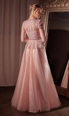 A woman in the Ladivine CD789 long dusty rose pink formal dress, featuring sleeves and intricate lace bodice detailing, stands before a large ornate mirror.