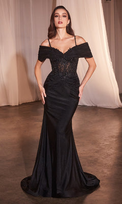 A woman stands indoors wearing the Sheer Lace-Bodice Long Prom Dress (CLCD798), featuring an off-the-shoulder black lace bodice and a floor-length skirt. White curtains are visible in the background.