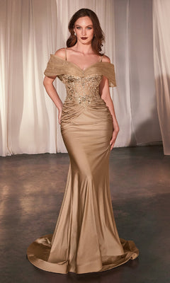 A woman wears the Sheer Lace-Bodice Long Prom Dress (CLCD798), featuring a gold, off-the-shoulder design with beaded embellishments, standing on a smooth floor with sheer curtains behind her.