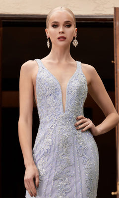 Woman wearing the Floral-Beaded Deep V-Neck Prom Dress CD981, a sleeveless light blue gown with beaded floral details, standing with one hand on her hip and accessorized with dangling earrings.