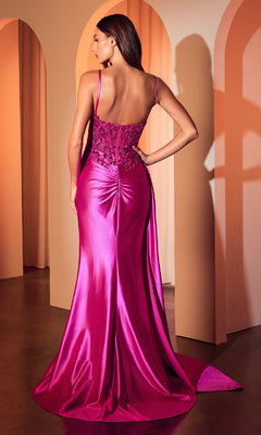 A woman stands with her back to the camera in a softly lit room, wearing the Side-Drape Long Corset Prom Dress: Ladivine CDS524—an elegant, floor-length satin gown with a ruched back and lace bodice, perfect for formal evenings.