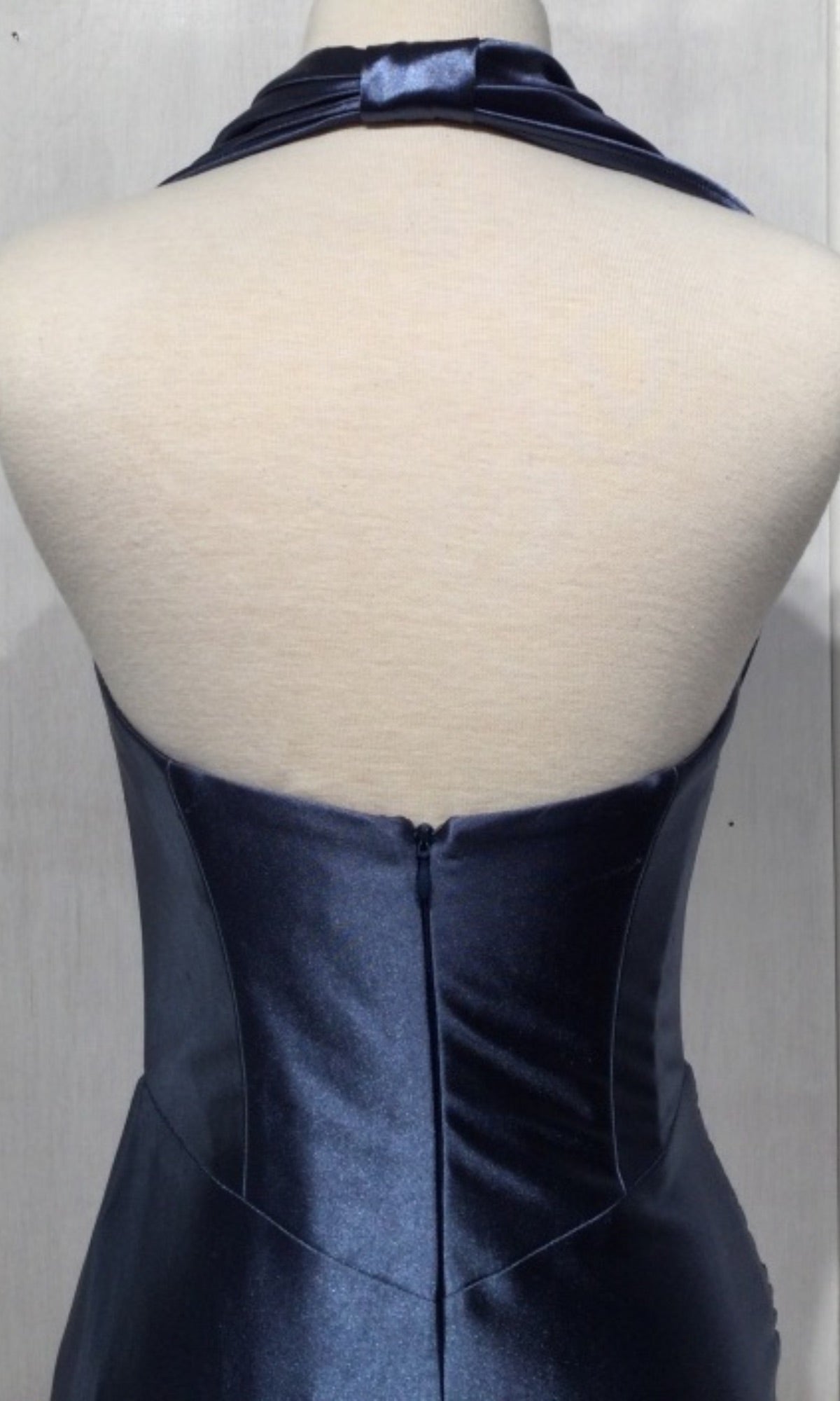 Back view of a mannequin wearing the Plus-Size Long Satin Prom Dress with Shawl CH116, featuring a dark blue satin fabric, halter neckline, visible zipper, and open back design.