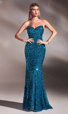 A woman models the Sheer-Sides Strapless Long Sequin Prom Dress CH151—a form-fitting, floor-length blue gown with sequins—standing hands on hips against a plain background.