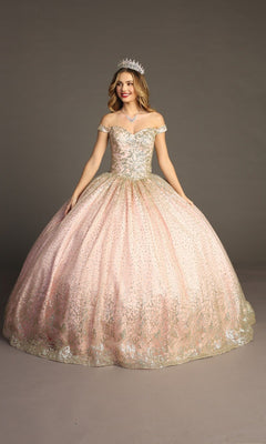 A woman in the Quinceanera Dress CHF3001 By Chicas, featuring a sparkling blush hue with metallic embroidery and a tiara, stands against a plain gray background, smiling with her arms slightly out to the side.