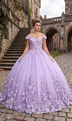 A woman wearing the Quinceanera Dress CHF3030 By Chicas in lilac stands on a cobblestone street in front of stone steps and a historic building.