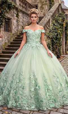 A woman wearing the Sage Quinceanera Dress CHF3030 By Chicas, featuring off-the-shoulder styling and 3D floral accents, stands on a stone path near ivy-covered old stone stairs.