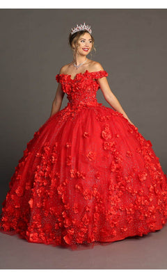 A woman stands against a plain gray background, wearing the exquisite Quinceanera Dress CHF3036 By Chicas in vibrant red—an off-shoulder tulle ballgown embellished with 3D floral accents—paired with a tiara and necklace, radiating elegance and charm.