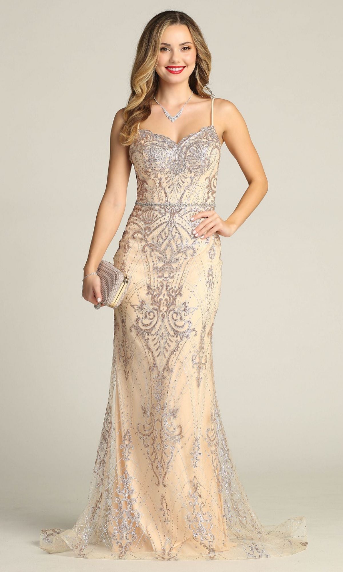 Woman wearing the Lace-Up Long Glitter Prom Dress: Chicas CHF3053—an elegant, floor-length gown with nude and silver sequins and spaghetti straps—holding a clutch and smiling at the camera against a plain background.
