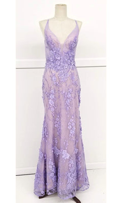 A mannequin showcases the Floral-Lace Long Prom Dress: Chicas CHF3058, a floor-length lavender gown with an open back, sleeveless design, deep V-neckline, and elegant floral lace appliqué.