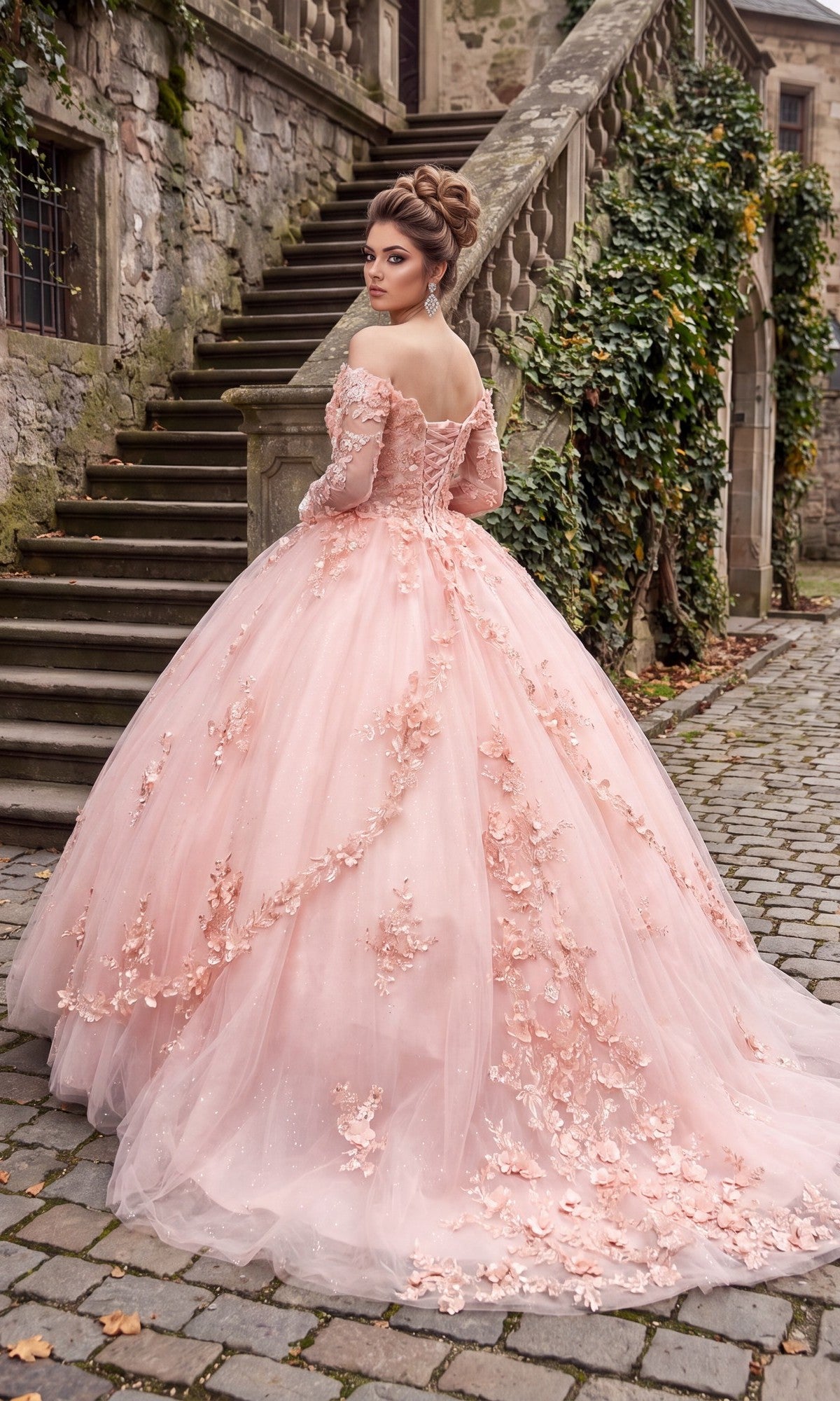 A woman in the Quinceanera Dress CHF3076 By Chicas, featuring a pink off-the-shoulder design with delicate floral details, stands on cobblestone near stone stairs and a vine-covered wall, looking back over her shoulder.