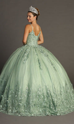 A woman wearing the Quinceanera Dress CHF3077 By Chicas—a light green glitter tulle ballgown adorned with delicate floral details and butterfly appliques—topped with a silver crown, stands against a plain gray background, facing away from the camera.