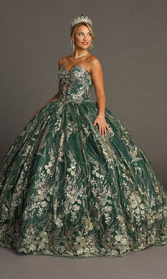 A woman stands against a plain gray background wearing the Quinceanera Dress CHF3079 By Chicas in Green/Gold—a strapless ballgown featuring metallic floral embroidery—accessorized with a tiara, necklace, and bracelet.