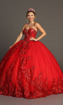 A woman wearing the Quinceanera Dress CHF3080 By Chicas—a vibrant red strapless ballgown featuring elaborate 3D floral appliques and glittering tulle—paired with a matching red tiara, necklace, and earrings, stands against a plain gray background.