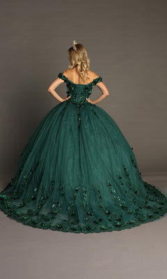 A woman wearing the Quinceanera Dress CHF3082 By Chicas, an off-shoulder dark green gown featuring a long train and intricate 3D floral appliques, stands with hands on hips, facing away.