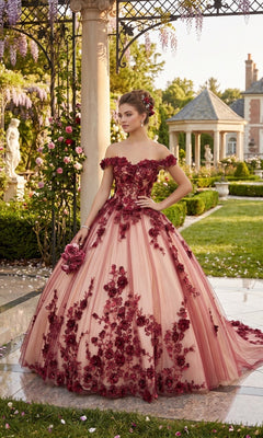 A woman wearing the Quinceanera Dress CHF3088 By Chicas—an off-the-shoulder, pink tulle ballgown adorned with red floral appliqués—stands in a formal garden near a gazebo and columns, radiating classic quinceañera elegance.