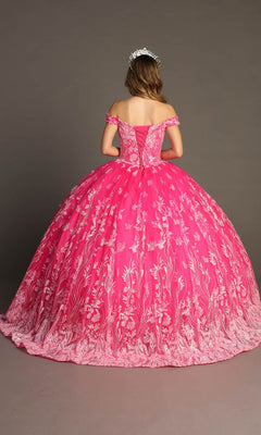 A young woman stands facing away, wearing the Quinceanera Dress CHF3100 By Chicas—a bright pink off-the-shoulder tulle ballgown adorned with white floral embroidery—paired with a tiara.