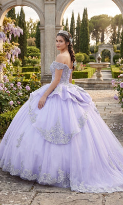 A woman wearing the Quinceanera Dress CHF3123 by Chicas stands in a formal garden with stone arches, flowers, and greenery in the background.