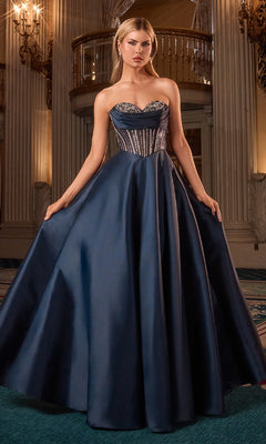 Woman wearing a blue strapless ball gown in an elegant interior setting